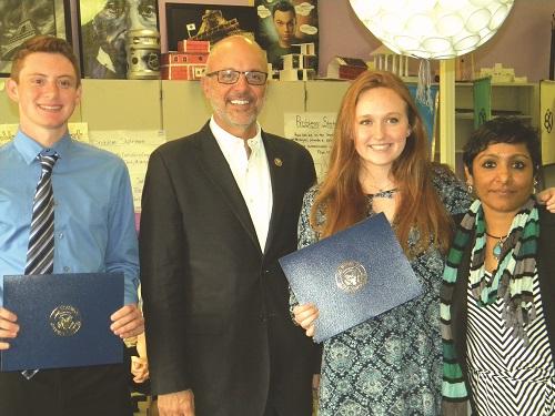 U.S. Congressman Ted Deutch (second from left) presented Olympic Heights Engineering Academy students Jared Spector (far left) and Kaylee Cunningham (third from left) with Congressional Commendations for winning a computer application design competition. Engineering teacher Ms. Nimmi (far right) was on hand for the presentation.