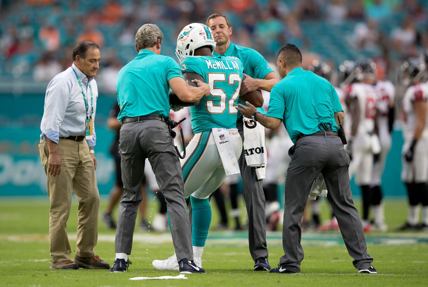 Miami Dolphins linebacker Raekwon McMillan (52) walks the sidelines, during  the second half of an NFL preseason football game against the Tampa Bay  Buccaneers, Thursday, Aug. 9, 2018, in Miami Gardens, Fla. (