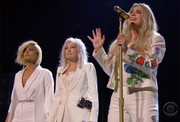 Bebe Rexha (left) and Cyndi Lauper performed Praying with Kesha (right) at the 2018 Grammy Awards. Camila Cabello, Andra Day, and Julia Michaels also joined in on the performance.