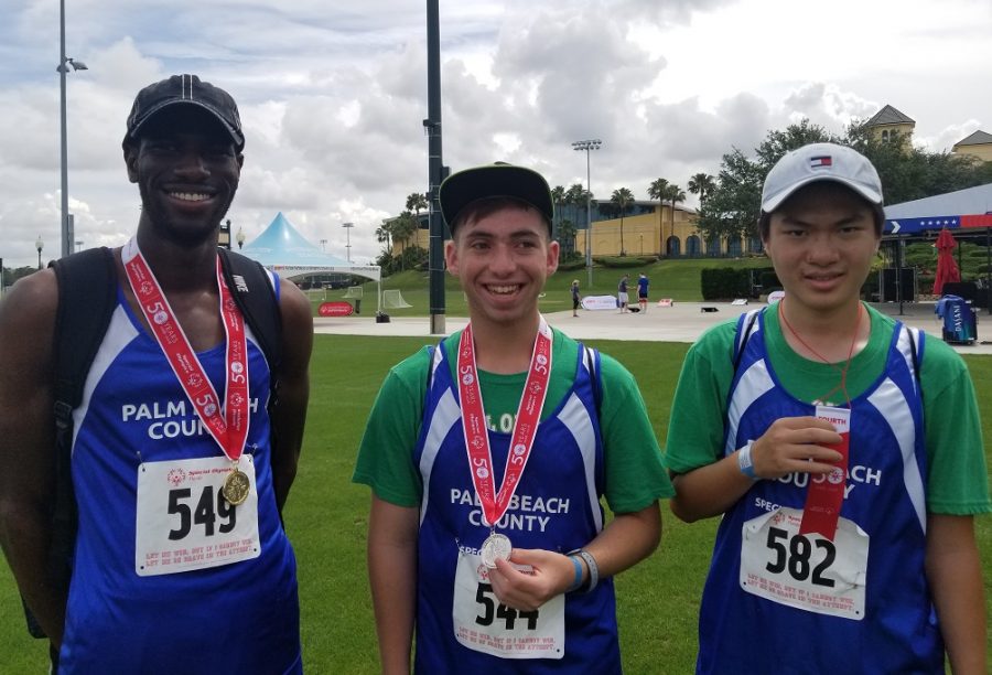 Olympic Heights Special Olympians (from left) Derrick Morgan, Ethan Litman, and Tai Zheng show off some of the hardware won at the State Games over the weekend of May 19.