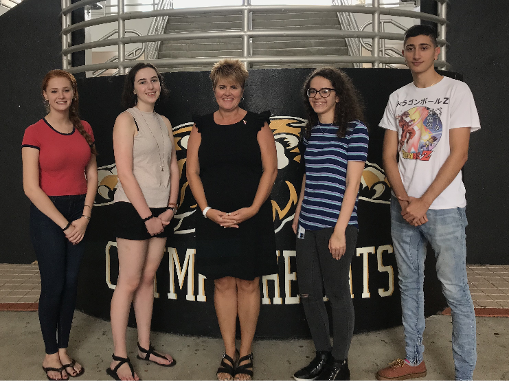 Olympic Heights four National Merit Semifinalists, pictured with OH principal Ms. Kelly Burke (center), are (from left to right): Alison Granirer, Alexa Domash, Alyson Garcia, and Francois Khouri.

