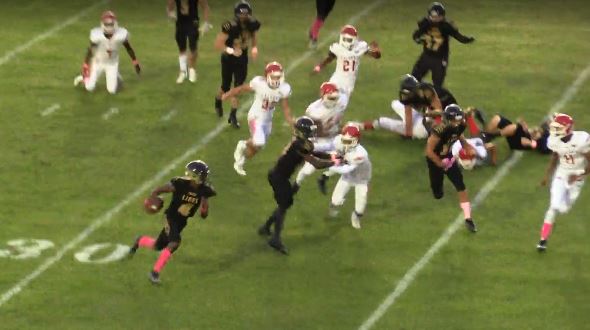 Lions quarterback Blake Moreland (#4, foreground) turns the corner for a sizeable gain on a second quarter run  in the 33-13 loss to Forest Hill on Thursday, Oct. 17.