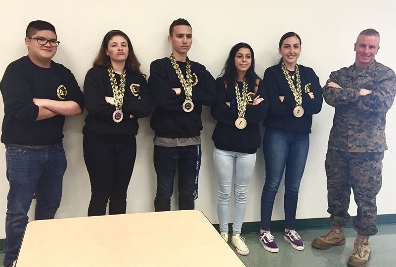 The Olympic Heights Marine Corp JROTC Marksmanship Team (from left: Kevin Chen, Sofie Sasso. Trenton Frangos, Julia arocha, and Nathalie Calderon, with instructor Master Sergeant Wayne Byron) placed second at the Superintendent’s Cup contest.