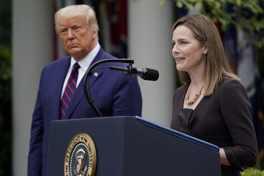 Supreme+Court+justice+nominee+Amy+Coney+Barrett+addresses+the+gathering+at+her+nomination+announcement+as+President+Donald+Trump+looks+on.