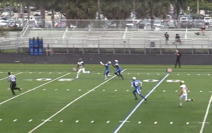 Lions wide receiver KAmeronn Joseph  (in white at the 22-yard line) gets ready to haul in a pass from quarterback Karvon Wright for a 48-yard gain in the Lions opening drive against Spanish River on Oct. 31.