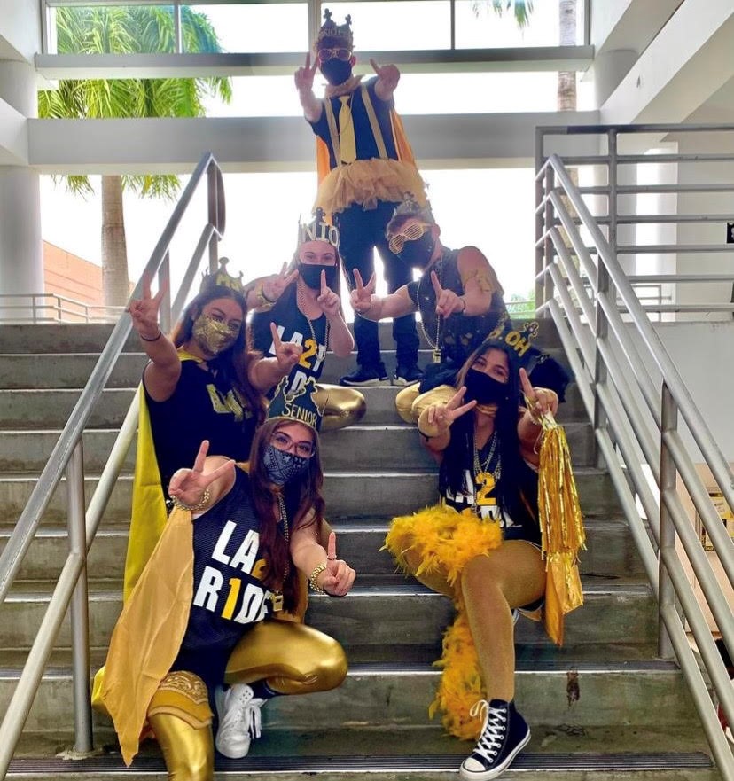 Olympic Heights SGA members model their outfits for Homecoming Spirit Weeks Black and Yellow Day.
