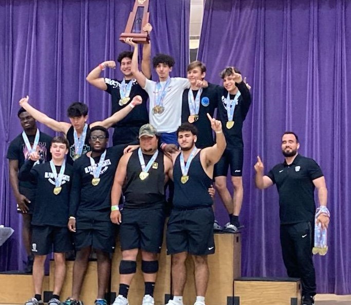 The Olympic Heights boys weightlifting team celebrate their Class 3A State Championship in the Snatch Competition. 