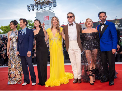 The cast of Dont Worry Darling at the Venice Film Festival. From left: Gemma Chan, Harry Styles, Sydney Chandler, director Olivia Wilde, Chris Pine, Florence Pugh and Nick Kroll.