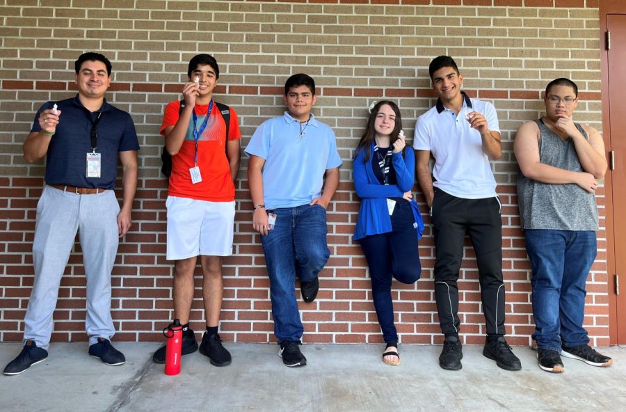 Mr. Alex Celis (far left) serves as the faculty adviser to the Olympic Heights Philosophy Club, which includes members (from second to the left): Mohammad Ali Zia, Camilo Herrera, Valeriia Tugai, Adam Hamedeh, and Roden Magnaye.