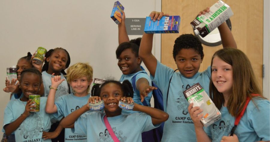 Children receive nutritional food items from the Palm Beach County Food Bank, one of several local organizations assisting families facing food insecurity.
